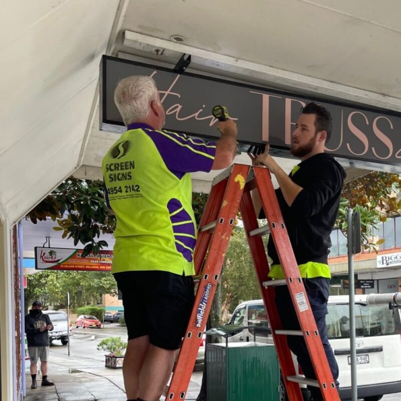 Screen Signs installing new shop awning signage for a hairdresser in Wallsend