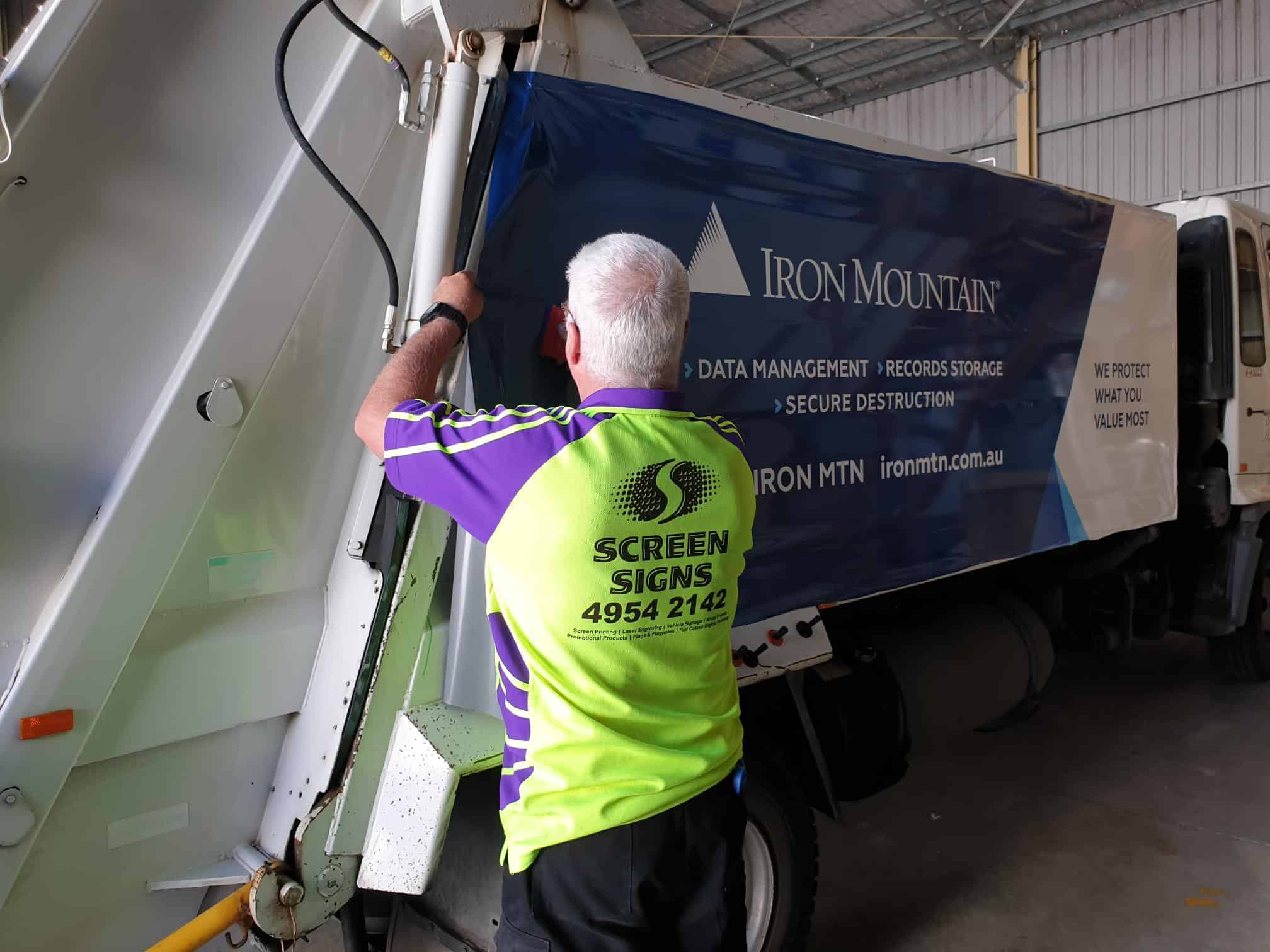 Fern from Screen Signs installing truck full vehicle wrap