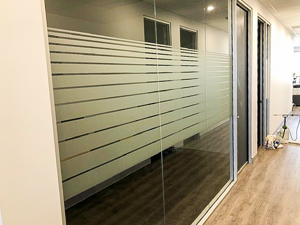 Glass window internal privacy glass strips for a business in hallway