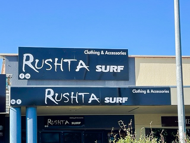 Awning and building signage for a retail shop in NSW with black and white design style