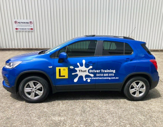 sign writing cardiff newcastle Vinyl cut vehicle signage design & installation in Cardiff That Driver Training Pasenger Side 2022 Completed