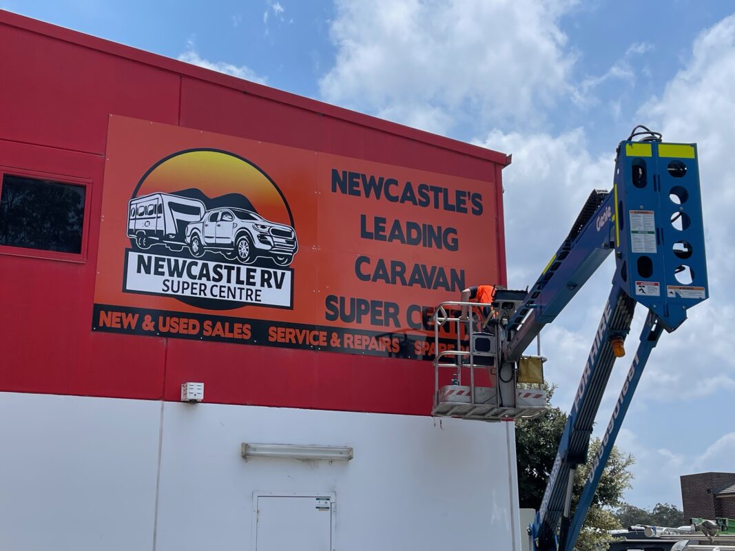 New outdoor building signage installation for a retail store in Newcastle